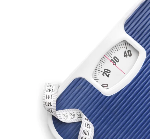 Scales and measuring tape on white background. Weight loss concept — Stock Photo, Image