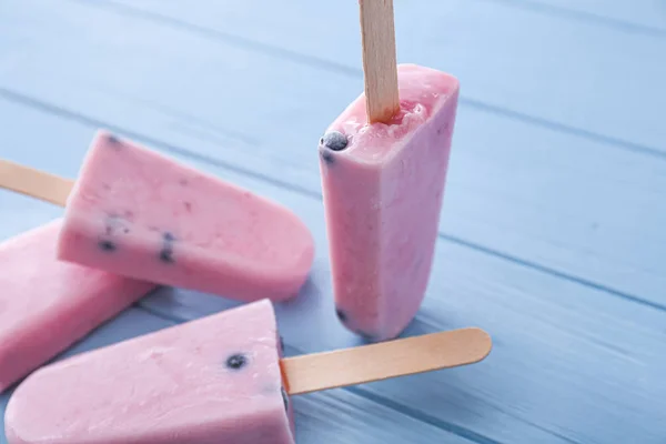 Tasty blueberry ice cream on wooden table — Stock Photo, Image