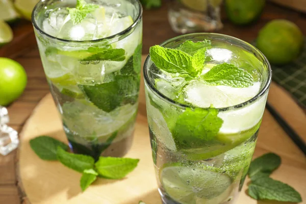 Glasses of fresh mojito on table, closeup — Stock Photo, Image