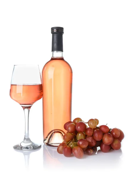 Glass and bottle of wine with grapes on white background — Stock Photo, Image