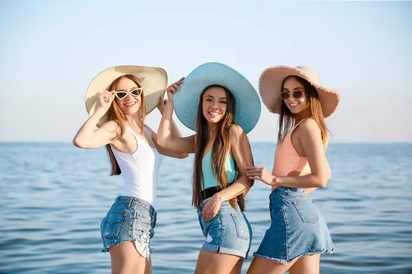 Beautiful young women on sea beach — Stock Photo, Image