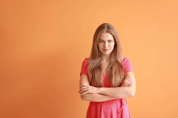 Portrait of beautiful woman on color background — Stock Photo, Image