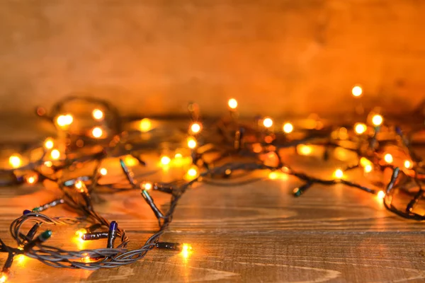 Beautiful Christmas lights on table — Stock Photo, Image