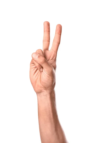 Mano masculina mostrando gesto de victoria sobre fondo blanco — Foto de Stock