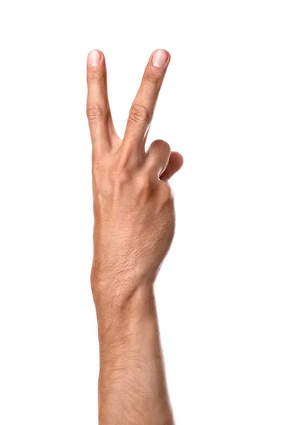 Férfi kéz mutatja győzelem gesztus fehér háttér — Stock Fotó