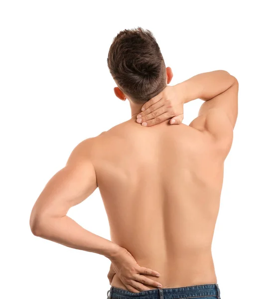 Молодий чоловік страждає від болю в спині на білому тлі — стокове фото