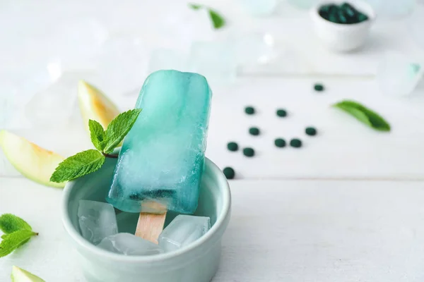 Bowl with tasty spirulina ice-cream on table — Stock Photo, Image