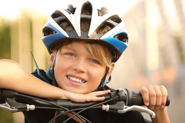 Cute boy with bicycle outdoors — Stock Photo, Image