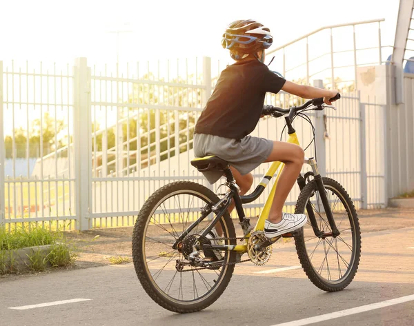 Cute boy riding bicycle outdoors — Stock Photo, Image