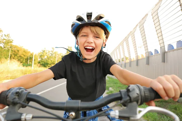 Cute boy riding bicycle outdoors — Stock Photo, Image