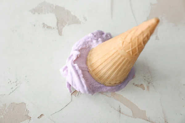 Wafer cone with tasty blueberry ice cream on white background — ストック写真