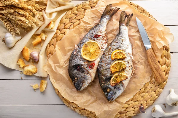 Prepared dorado fish on white table — Stock Photo, Image