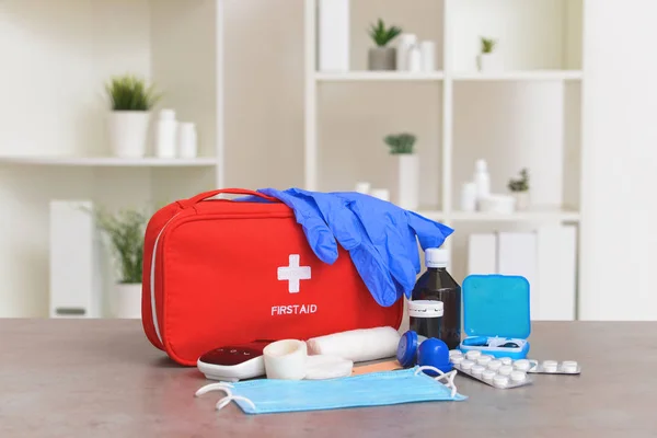 First aid kit on table in clinic — ストック写真