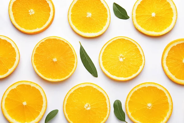 Ripe cut oranges on white background — Stock Photo, Image