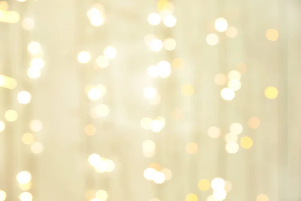 Blurred Christmas lights on light background — Stock Photo, Image