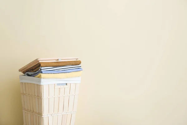 Basket with laundry on light background — Stock Photo, Image