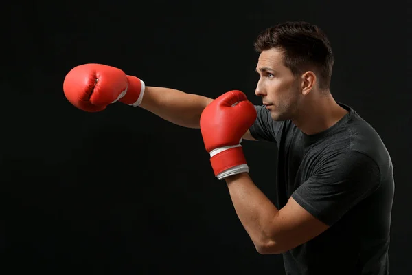 Sporty male boxer on dark background — ストック写真