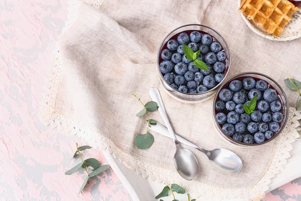 Glasses with blueberry dessert on table — Stock Photo, Image
