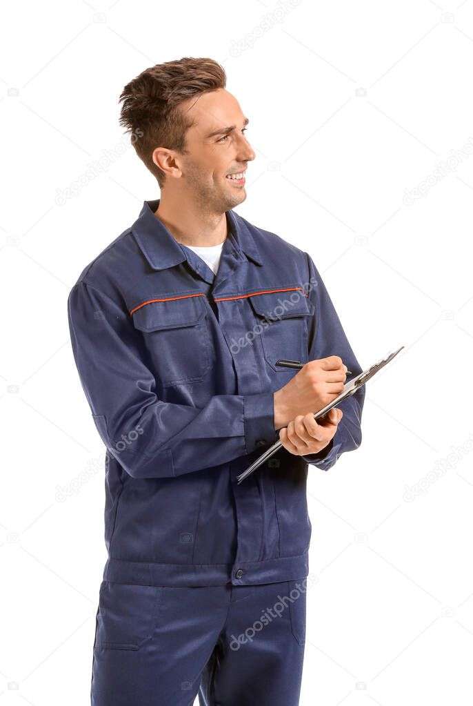 Male car mechanic with clipboard on white background