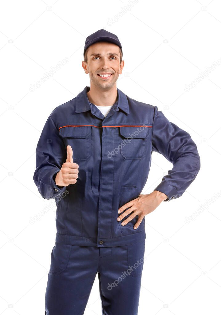 Male car mechanic showing thumb-up on white background