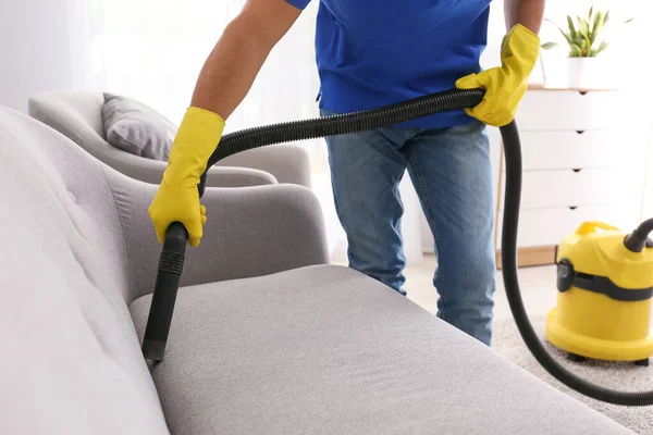 Young man cleaning his flat — Stock Photo, Image