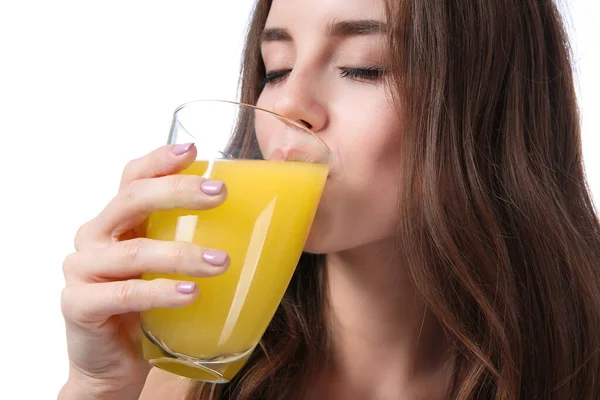 Beautiful young woman with orange juice on white background — Stock Photo, Image