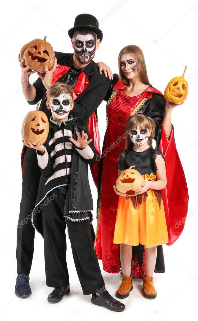 Family in Halloween costumes and with pumpkins on white background