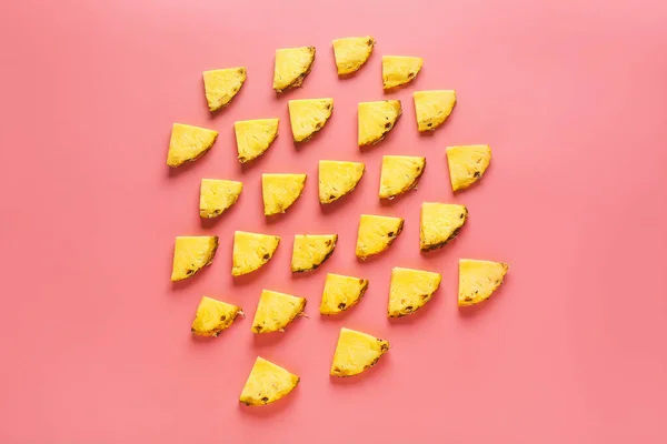 Many slices of pineapple on color background — Stock Photo, Image