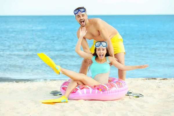 Happy couple resting at sea resort