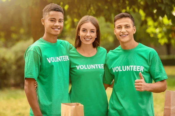 Team of young volunteers outdoors — Stock Photo, Image