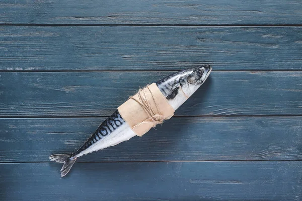 Fresh mackerel fish on wooden table — Stock Photo, Image