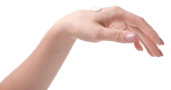 Main féminine avec crème sur fond blanc — Photo