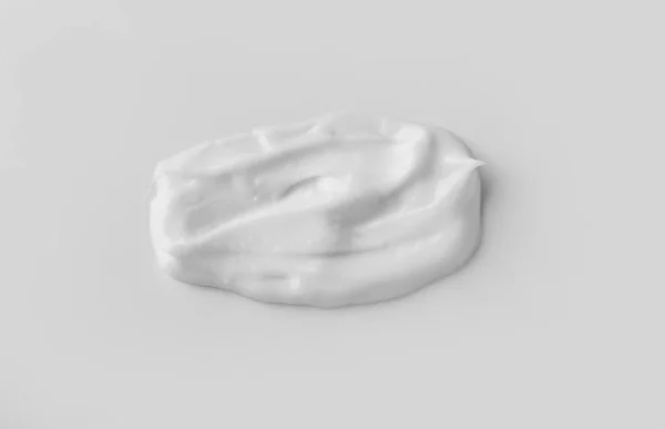 Sample of cream on white background — ストック写真