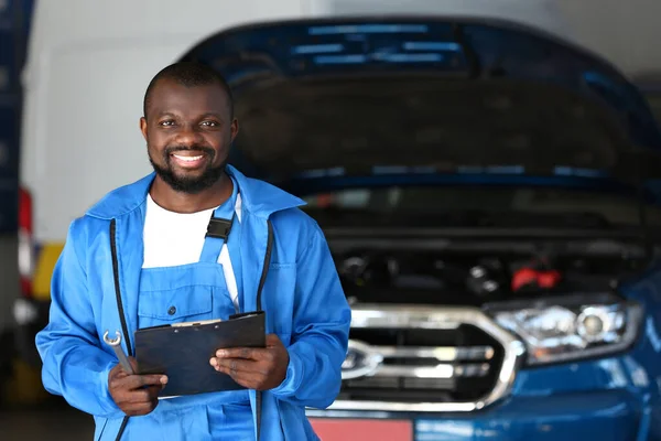African-American mechanic in car service center
