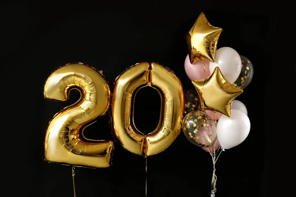 Figure 20 and different balloons on dark background — Stock Photo, Image