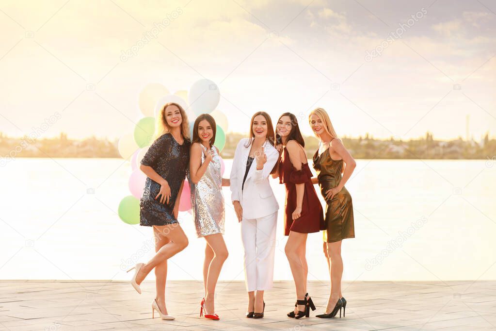 Beautiful young women at hen party near river