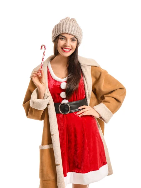 Bella giovane donna in costume di Babbo Natale e con canna da zucchero su sfondo bianco — Foto Stock