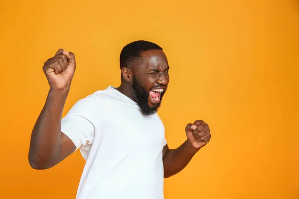 Happy African-American man on color background — Stock Photo, Image