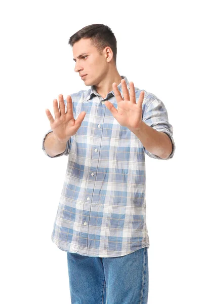 Retrato de un joven guapo rechazando algo sobre fondo blanco — Foto de Stock