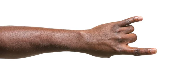 Hand of African-American man showing "devil horns" gesture on white background — Stock Photo, Image
