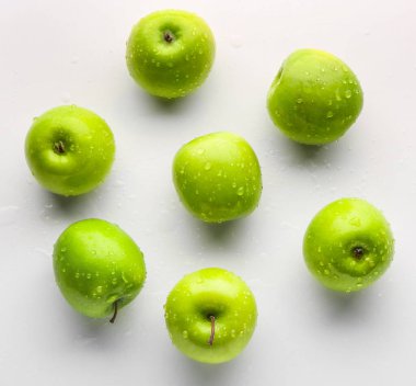 Fresh ripe apples on light background