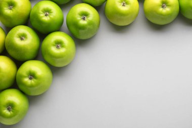 Fresh ripe apples on light background