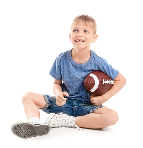 Lindo niño pequeño con pelota de rugby sobre fondo blanco —  Fotos de Stock