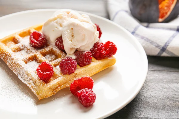 Tasty waffle with ice-cream and berries on plate, closeup — Stock Photo, Image