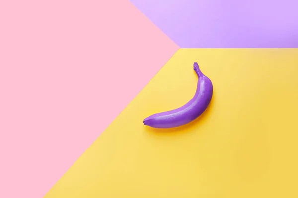 Ripe painted banana on color background — Stock Photo, Image