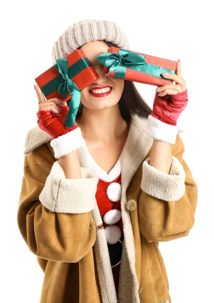 Beautiful young woman with Christmas gifts on white background — Stock Photo, Image