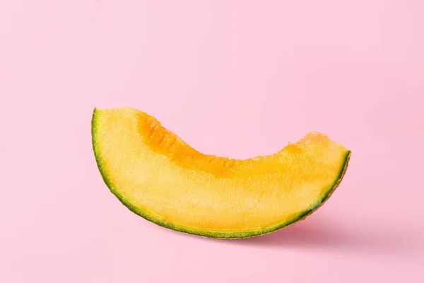 Slice of ripe melon on color background — Stock Photo, Image