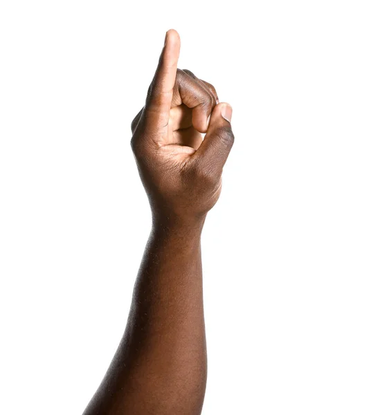 Hand of African-American man pointing at something on white background — Stock Photo, Image