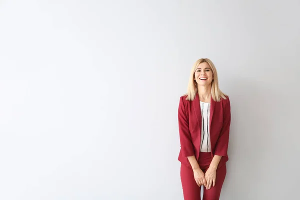 Beautiful stylish businesswoman on light background — Stock Photo, Image