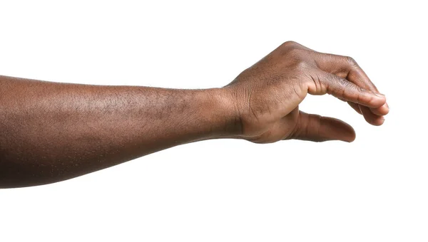 Hand afroamerikansk man håller något på vit bakgrund — Stockfoto